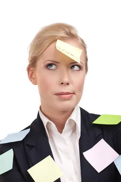Mulher de negócios cansada com adesivos coloridos em seu rosto — Fotografia de Stock