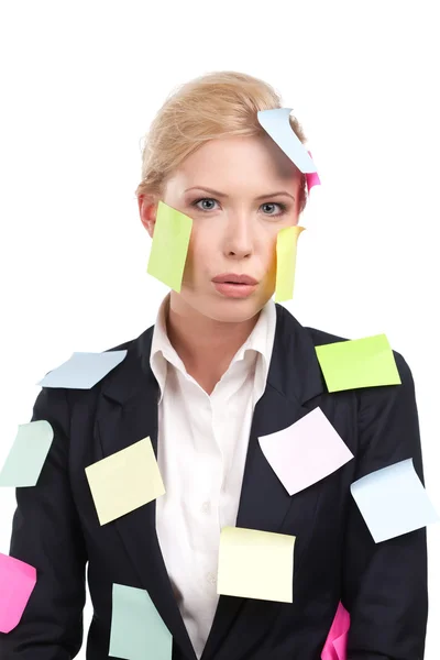 Attractive businesswoman with colored stickers on her face — Stock Photo, Image