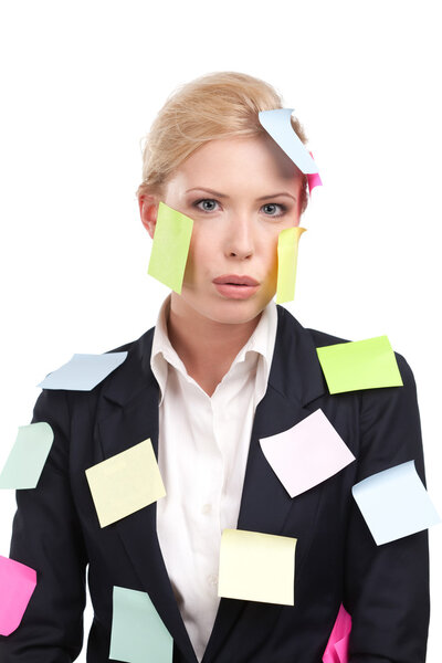 Attractive businesswoman with colored stickers on her face