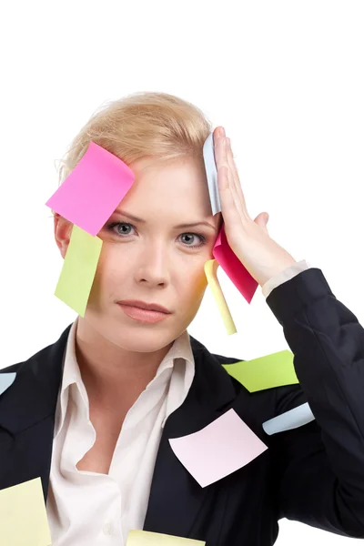 Young busineswoman with colored stickers on her face — Stock Photo, Image