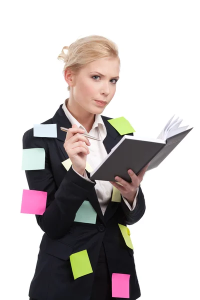 Young business woman in a black suit holding pen — Stock Photo, Image