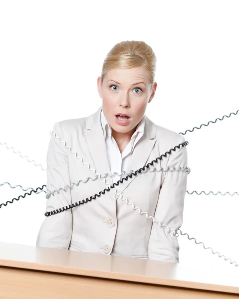 Junge Geschäftsfrau mit Telefonkabel gefesselt — Stockfoto