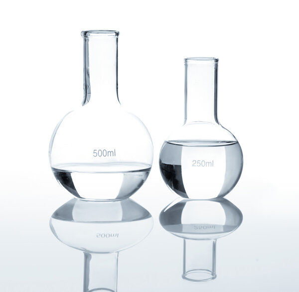 Empty laboratory flasks with a clear liquid