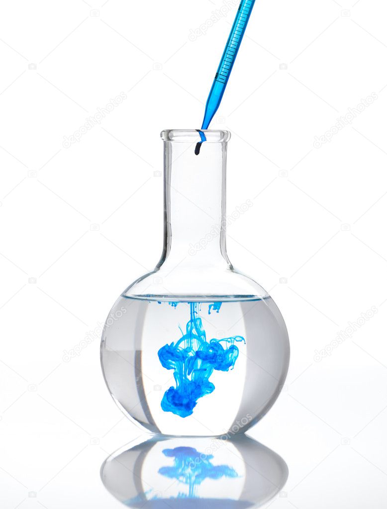 Flask full of clear liquid with a blue reagent
