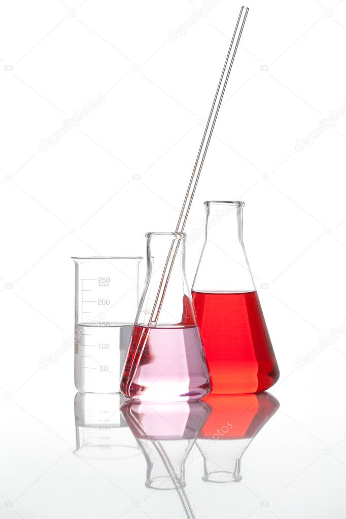 Glass flasks with a red liquid