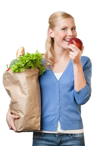 Vacker kvinna med en väska full av hälsosamma livsmedel — Stockfoto