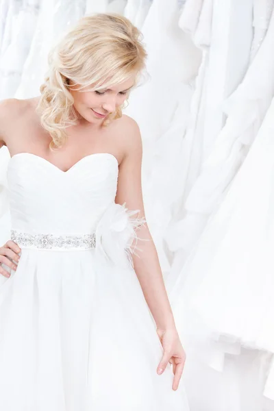 Trying on a charming wedding gown — Stock Photo, Image