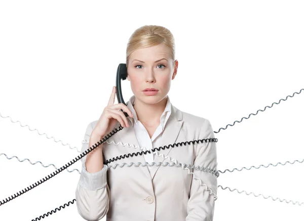Jonge zakenvrouw met telefoon koord gebonden — Stockfoto