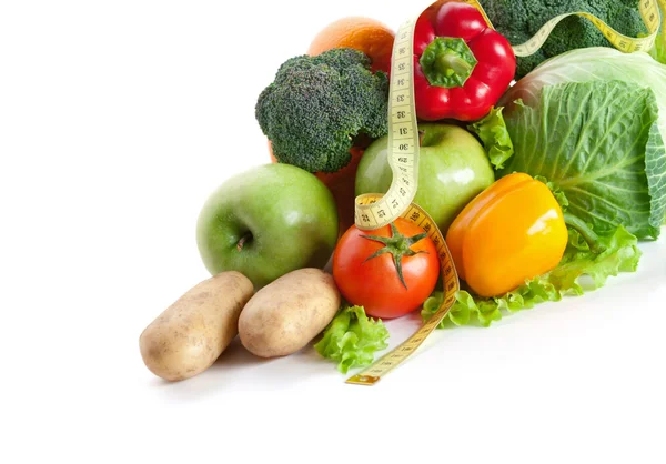 Bunch of fresh vegetables with measuring tape — Stock Photo, Image