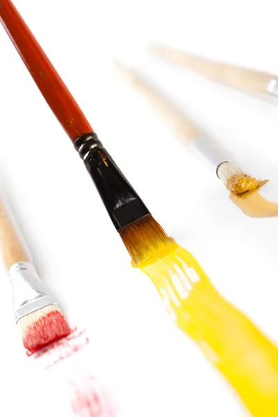 Brushes with different colored ink — Stock Photo, Image