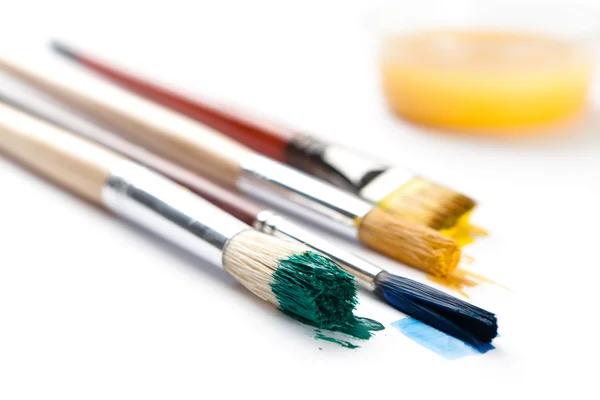 Set of brushes near the ink container — Stock Photo, Image