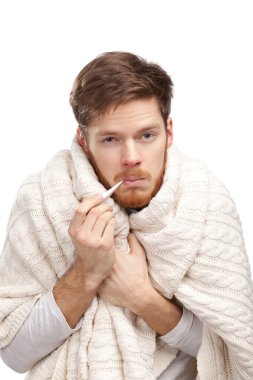 Sick young man holding thermometer clipart