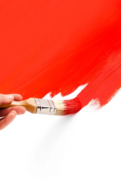 Ζωγραφική με κόκκινο μελάνι στο χρώμα και πινέλο — Φωτογραφία Αρχείου