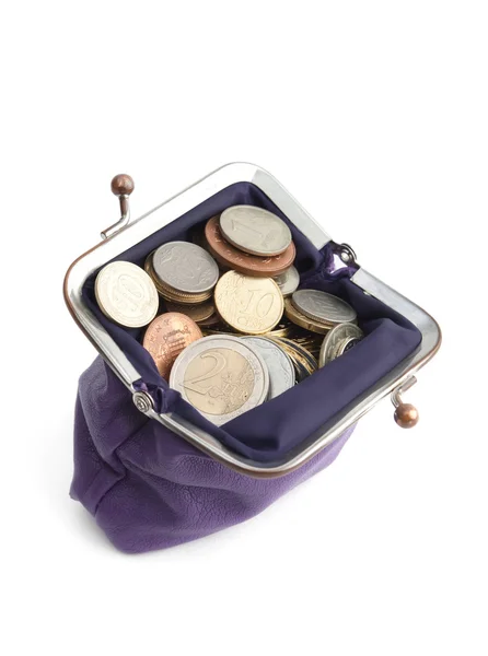Violet tas is vol gouden, zilveren en bronzen munten, geïsoleerd op wit — Stockfoto