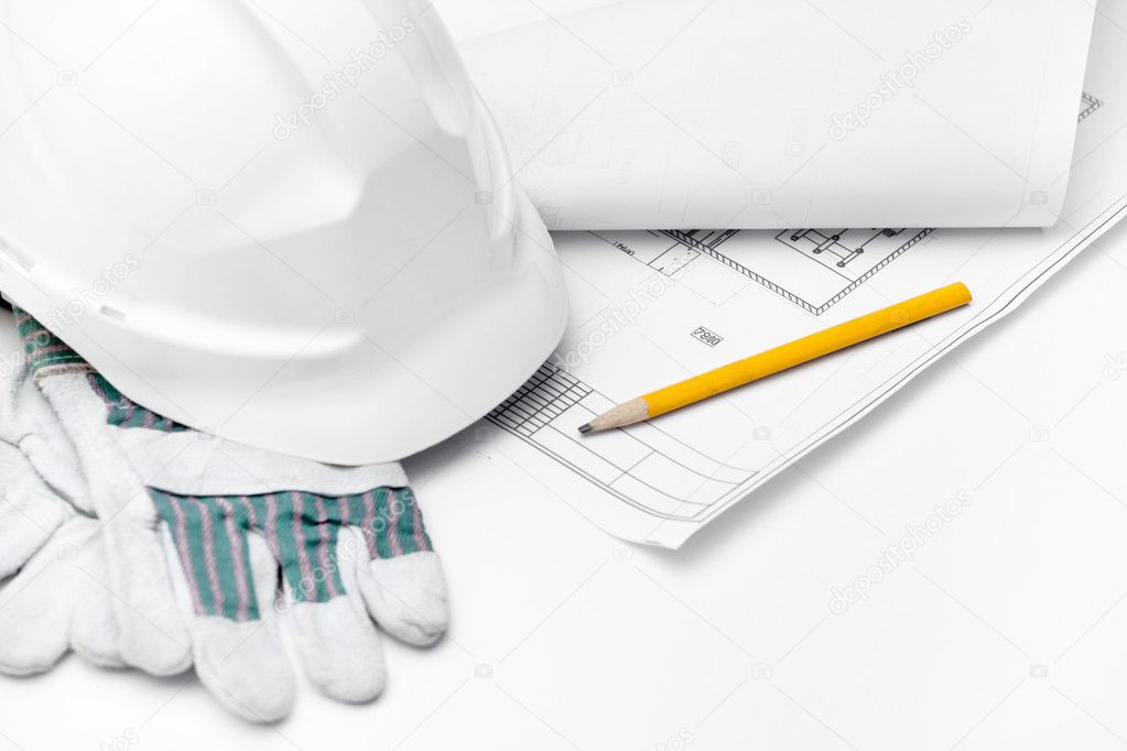 White hard hat on the gloves, pencil on the druft, isolated on white