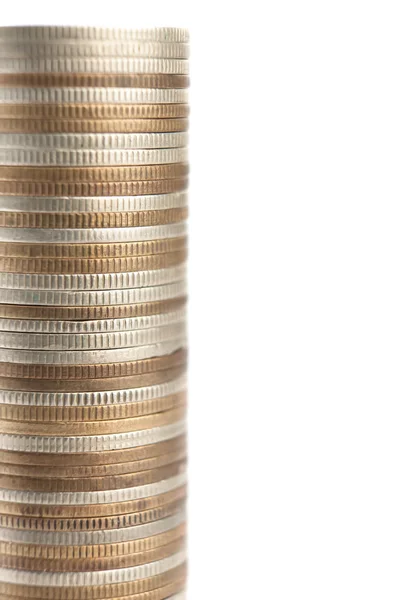 Mixture of gold, bronze and silver coins stands vertically in tall column — Stock Photo, Image