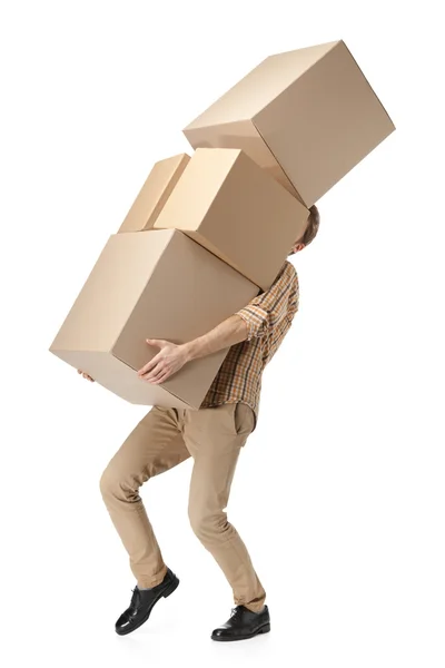 Man hardly carries the cardboard boxes — Stock Photo, Image