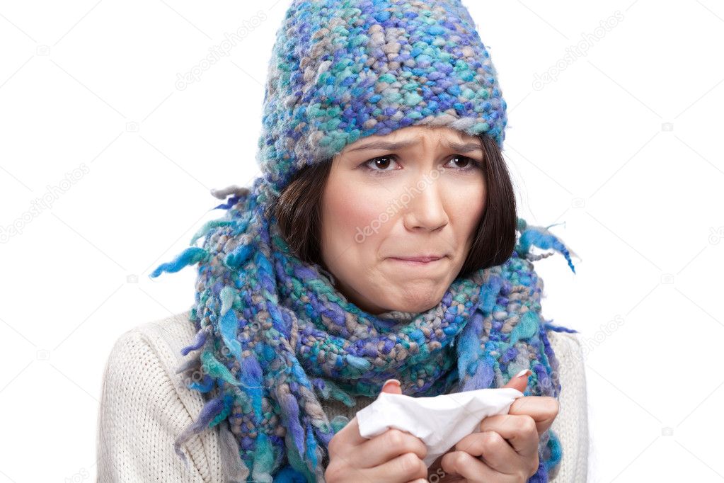 A cold young woman holding wipe