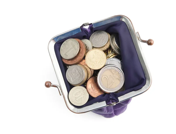 Violet tas is vol gouden, zilveren en bronzen munten, geïsoleerd op een witte achtergrond — Stockfoto