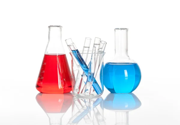 Chemical flask with a glass test tubes inside — Stock Photo, Image