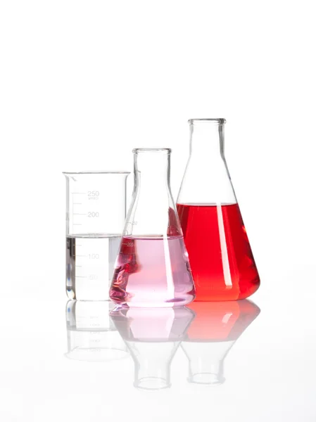 Laboratory flasks with a red liquid