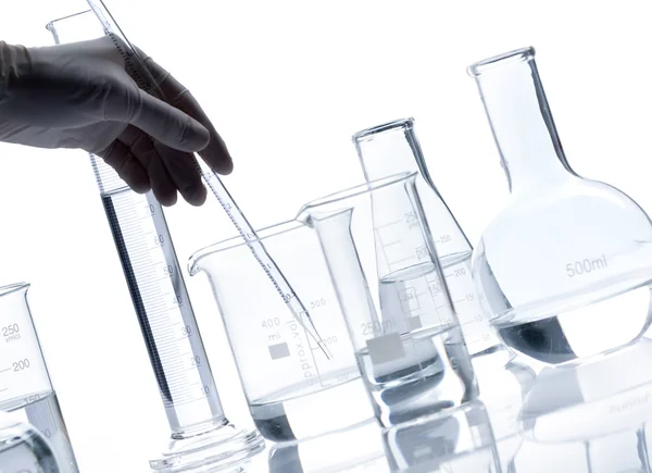 Group of glass flasks with a clear liquid — Stock Photo, Image