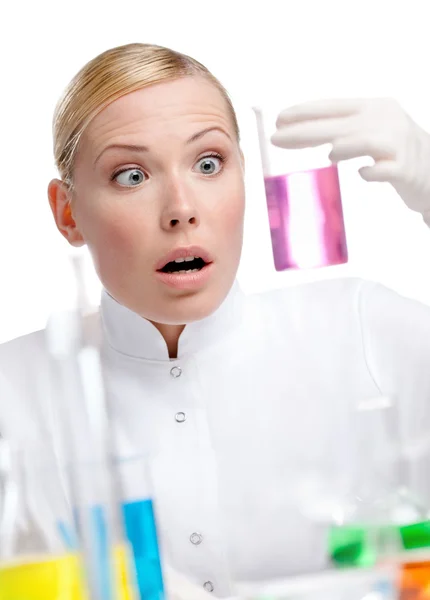 Young lady scientist wonders at the beaker — Stock Photo, Image