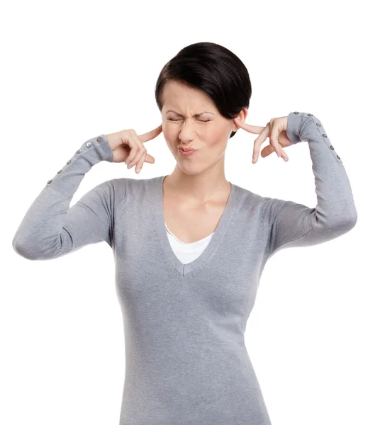 Closing ears with fingers woman screws up her eyes — Stock Photo, Image