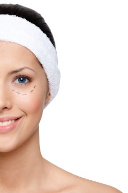 Woman agrees to make a facelift, half-viewed face clipart