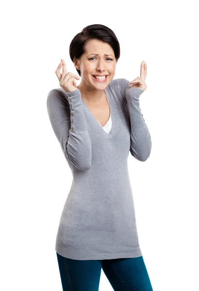 Hoping woman shows crossed fingers — Stock Photo, Image