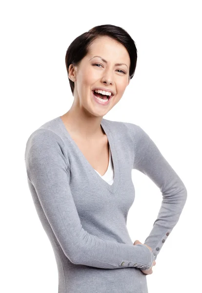 Śmiejąc się kobieta z rękami na biodrach — Zdjęcie stockowe