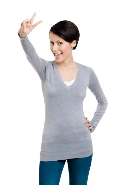 Smiley woman shows peace sign — Stock Photo, Image