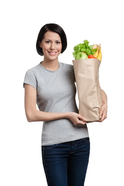 Att hålla paketet full av hälsosamma produkter — Stockfoto