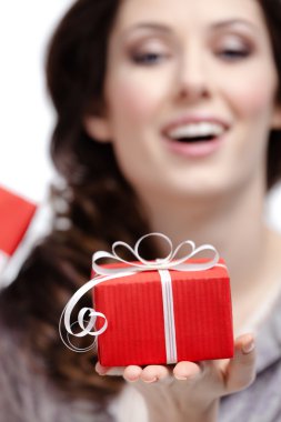 Young woman shows a gift clipart