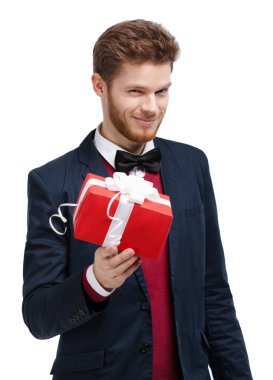 Man in bow tie offers a present clipart