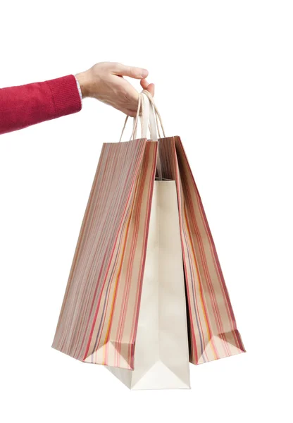 Przekazanie trzy torby papierowe — Zdjęcie stockowe