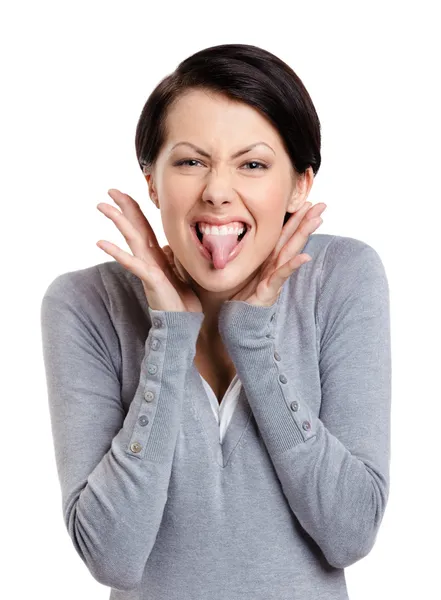 Pretty woman puts out tongue — Stock Photo, Image