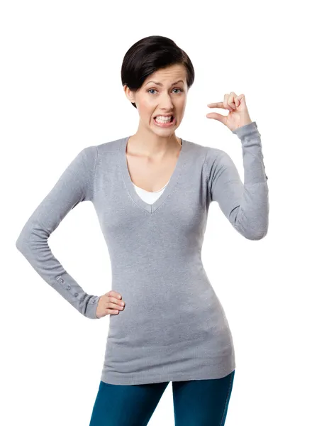 Dissatisfied woman gestures small amount — Stock Photo, Image