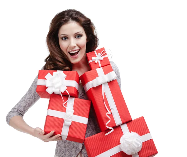 Frau überreicht mehrere Geschenkboxen mit weißen Bändern — Stockfoto