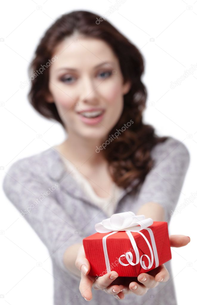 Young woman offers a present