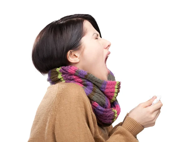 Sneezing young attractive woman holding wipe — Stock Photo, Image