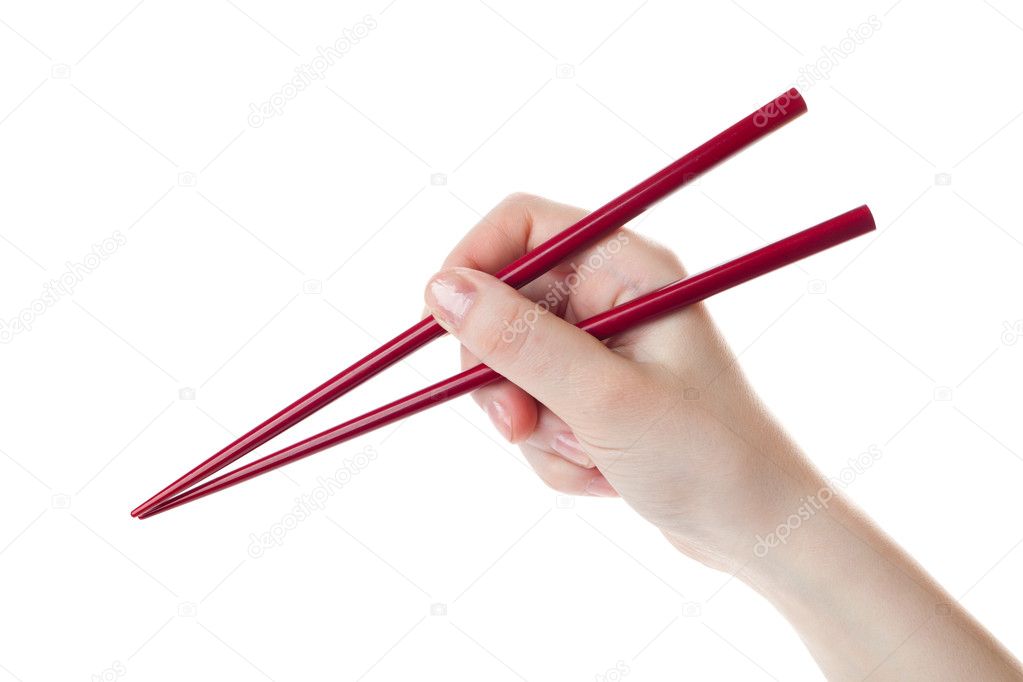 Hand holds the chopsticks