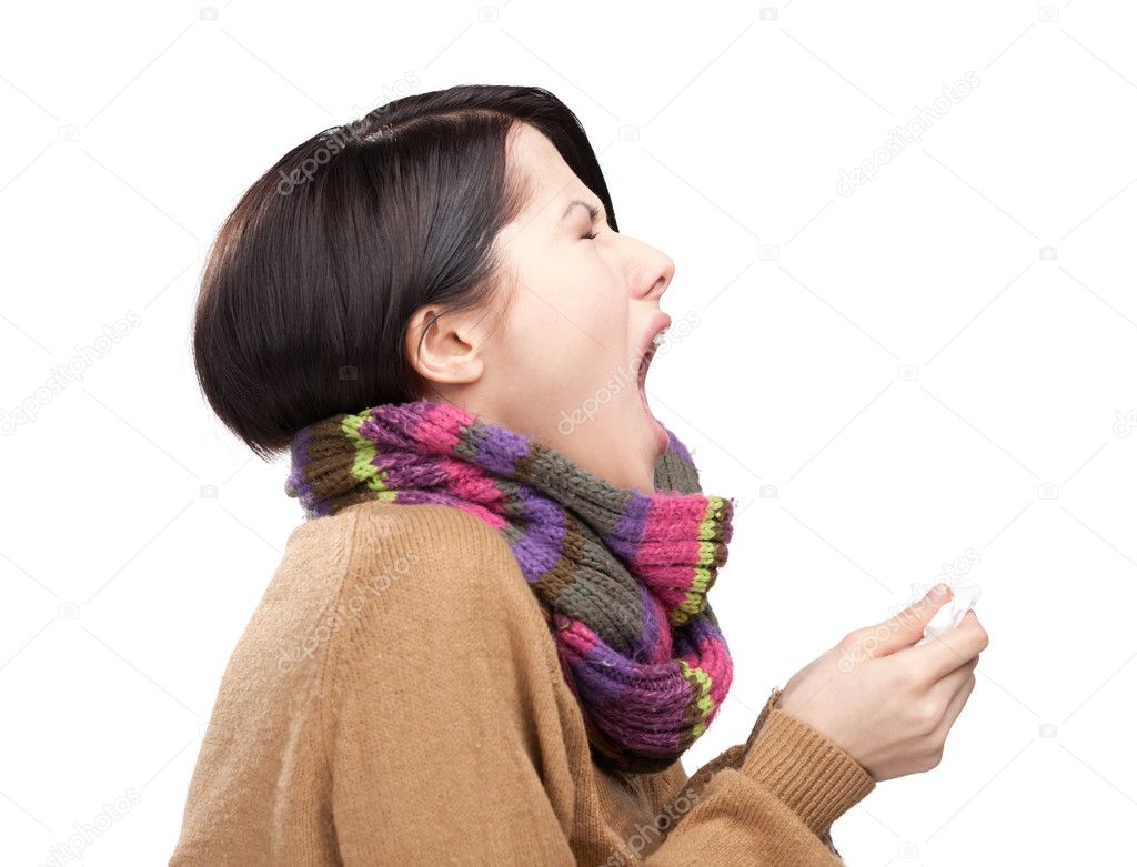 Sneezing young attractive woman holding wipe