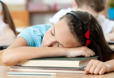 Sleeping at the desk, close up clipart