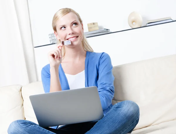 Pretty woman dreams about purchasing through the internet — Stock Photo, Image
