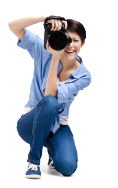 Pretty girl-photographer takes images clipart