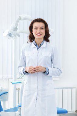 Charismatic assistant welcomes the patient clipart