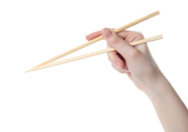 Hand holds the chopsticks clipart