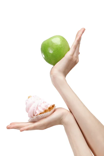 Pochybuje mezi dortík a zelené jablko — Stock fotografie