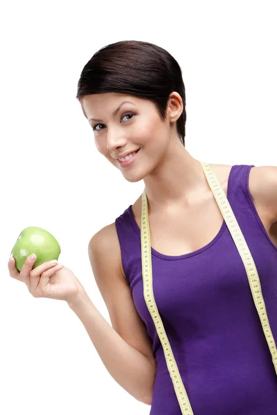 Dieta žena s flexibilní vládce a zelené jablko — Stock fotografie